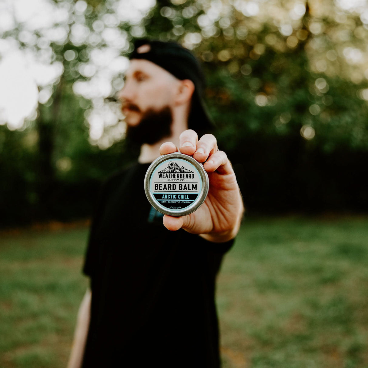 Person holding Arctic Chill Beard Balm Outside In Nature