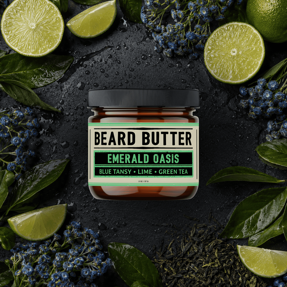 Jar of 'Beard Butter Emerald Oasis' surrounded by limes and leaves on a dark surface