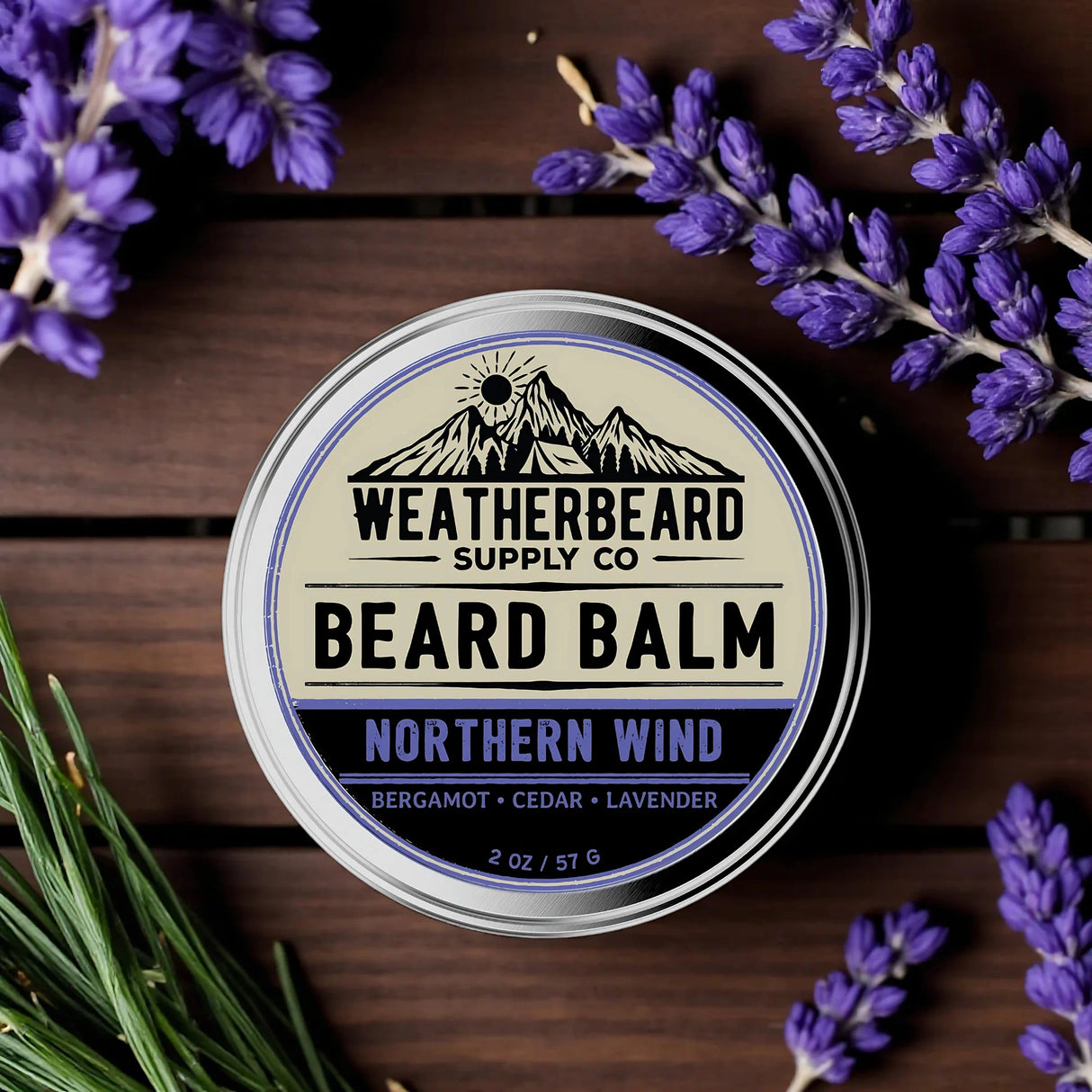 Weatherbeard Supply Co. Northern Wind beard balm container with lavender flowers on a wooden surface