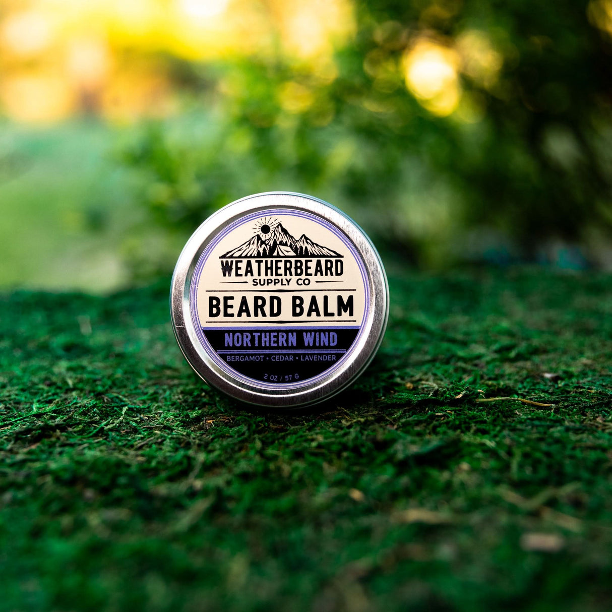 Up close image of Northern Wind Beard Balm sitting in the grass