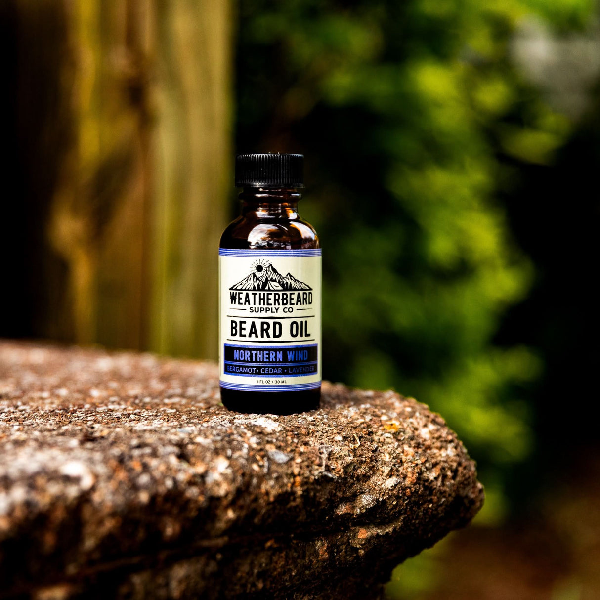Northern Wind Beard Oil by Weatherbeard Supply Co sitting outside on a step