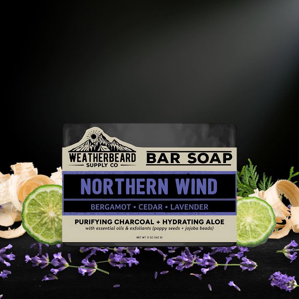 Weatherbeard Supply Co. Northern Wind bar soap packaging with natural elements on a dark background