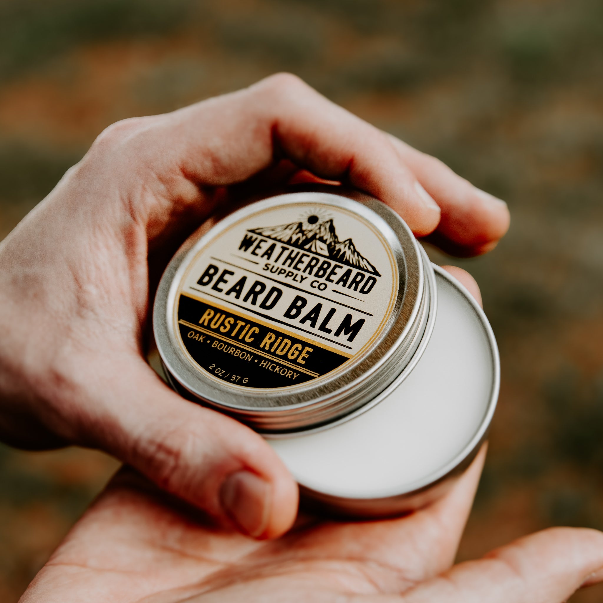 Open container of Rustic Ridge Beard Balm with notes of Oak, Bourbon, and Hickory