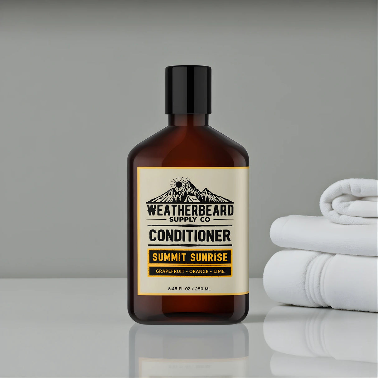 Bottle of Weatherbeard Supply Co. Summit Sunrise beard conditioner with a label, next to folded white towels on a gray background.