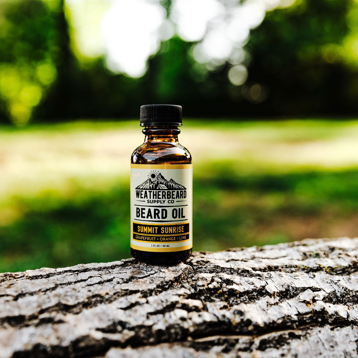 Summit Sunrise Beard Oil sitting outside in nature