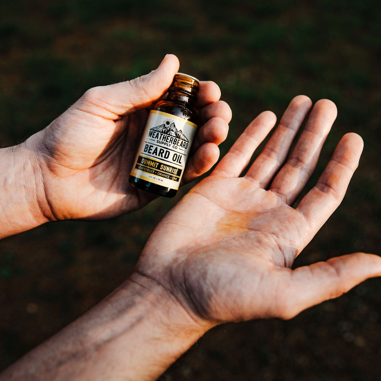 Person showcasing Weatherbeard Supply Co Beard Oil consistency in hand