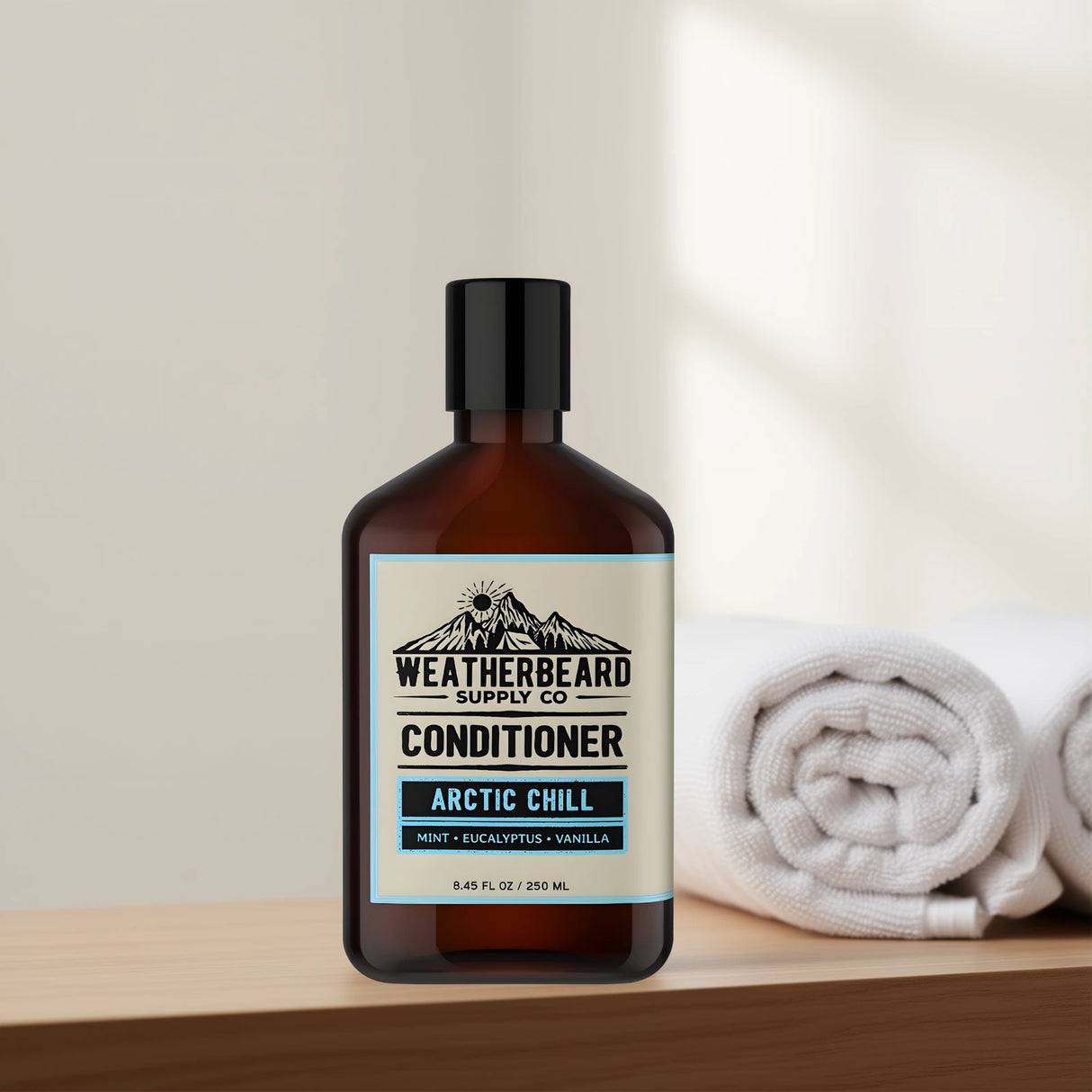 Bottle of Weatherbeard Supply Co beard conditioner with towels in the background