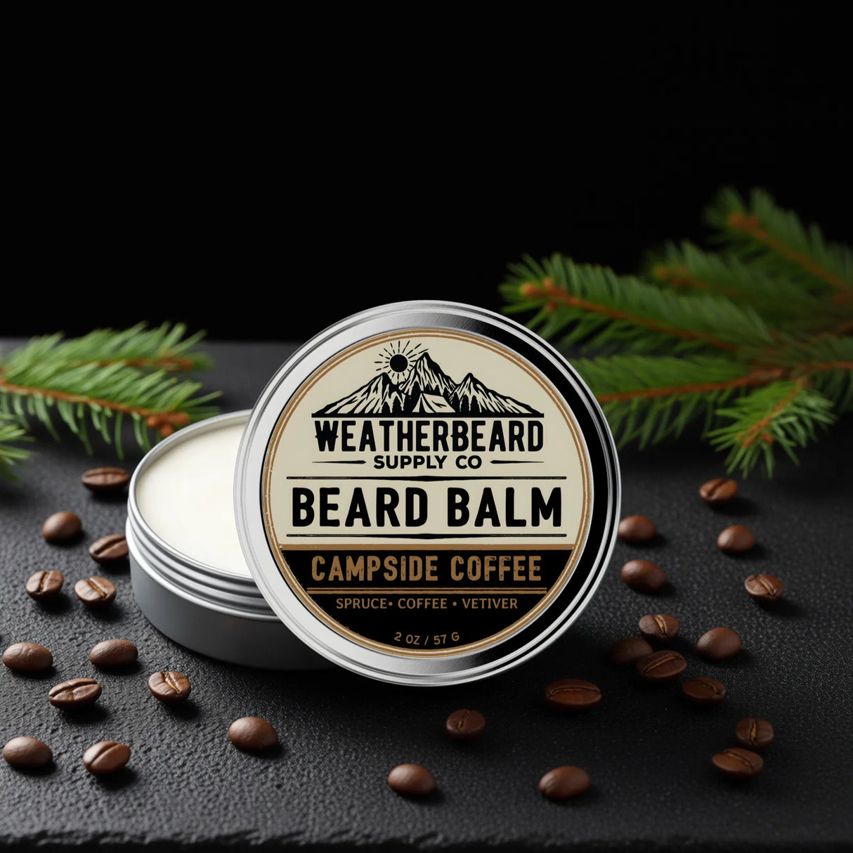 Campside Coffee Beard balm container with 'Weatherbeard Supply Co' branding on a dark surface with coffee beans and pine branches.