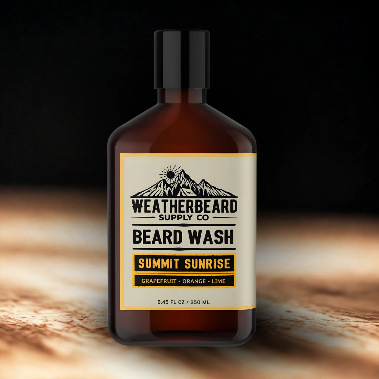 Bottle of Weatherbeard Supply Co. Citrus Beard Wash with a mountain label on a dark background