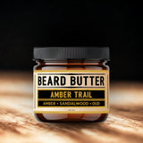 Jar of Beard Butter Amber Trail on a wooden surface with a dark background