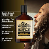 Bottle of Weatherbeard Supply Co's Amber Trail Beard Wash with benefits listed beside it