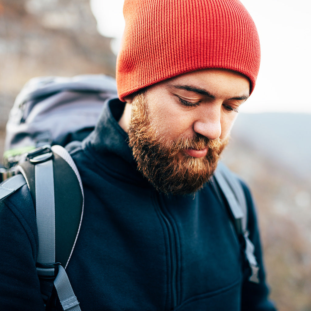 A bearded man hiking in the great outdoors