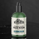Green bottle of Weatherbeard Supply Co Botanical Peptide Face Wash on a black marble table