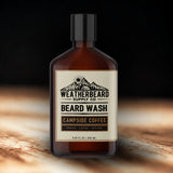 Bottle of Weatherbeard Supply Co beard wash on a dark background