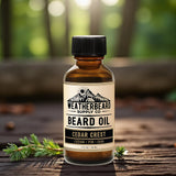 Bottle of Weatherbeard Supply Co. Cedar Crest beard oil on a wooden surface with a forest background.