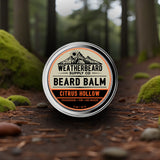 Weatherbeard Supply Co Citrus Hollow beard balm sitting in a forest setting