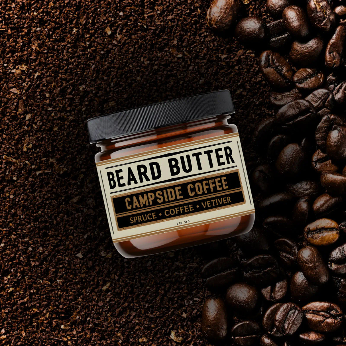 Jar 'Campside Coffee' beard butter surrounded by coffee beans on a dark background