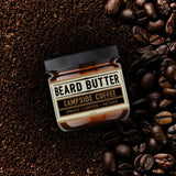 Jar 'Campside Coffee' beard butter surrounded by coffee beans on a dark background