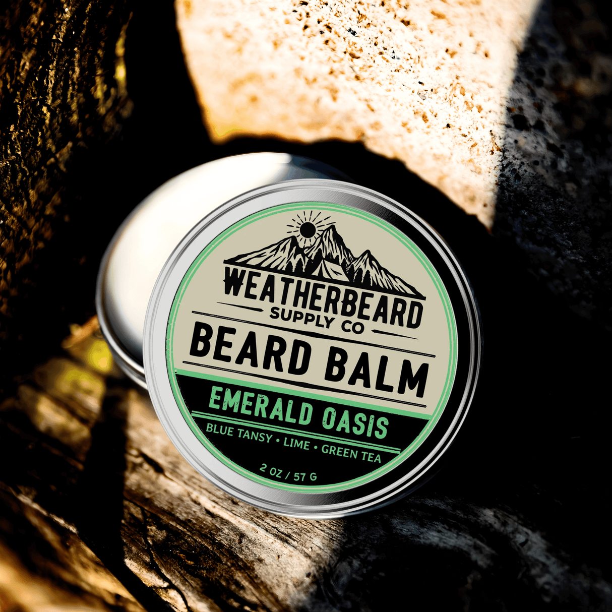 Tin of Weatherbeard Supply Co. Emerald Oasis Beard Balm on a wooden surface