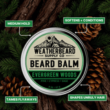 Weatherbeard Supply Co Evergreen Woods beard balm tin with natural elements on a dark background