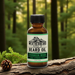 Bottle of Weatherbeard Supply Co. Evergreen Woods beard oil on a log with a forest background