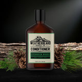 Bottle of Weatherbeard Supply Co. Evergreen Woods beard conditioner with natural elements on a dark background
