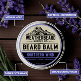 Tin of Weatherbeard Supply Co's Northern Wind beard balm container on a wooden background with product highlights featured