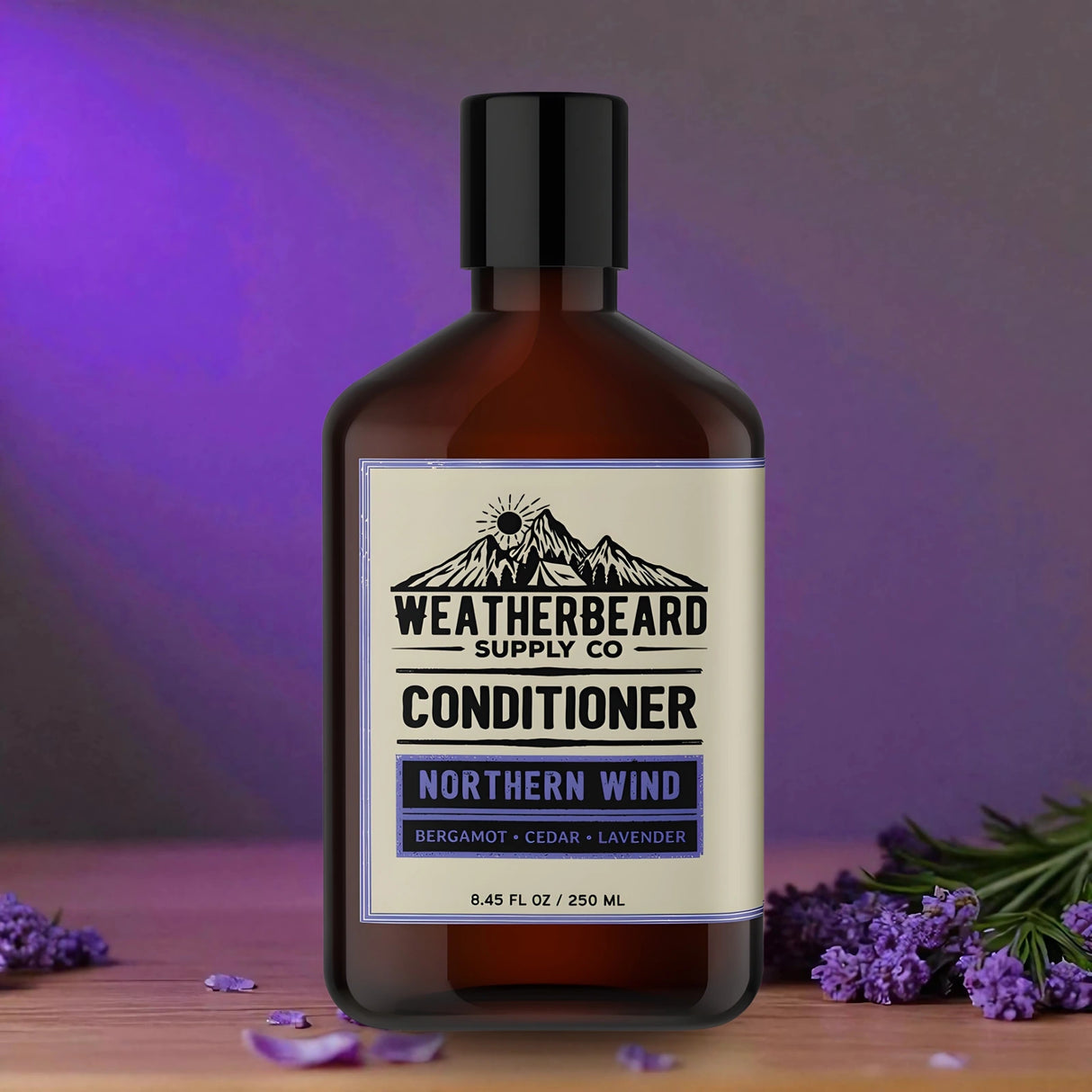 Bottle of Weatherbeard Supply Co. Northern Wind conditioner with lavender flowers on a wooden surface and purple background.