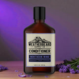 Bottle of Weatherbeard Supply Co. Northern Wind conditioner with lavender flowers on a wooden surface and purple background.