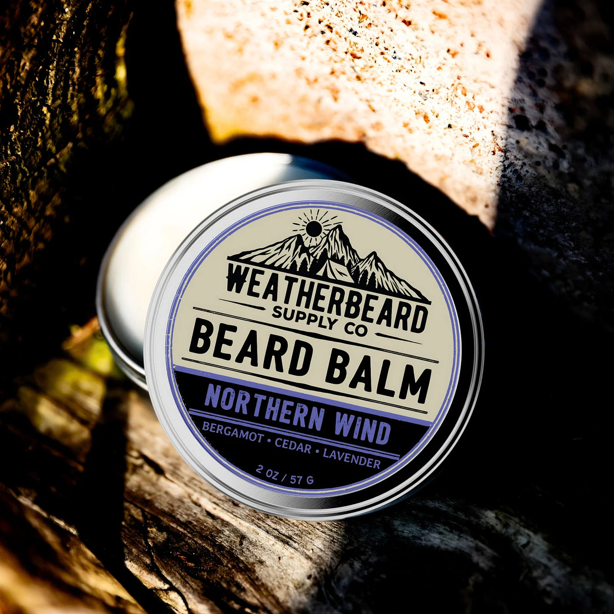 Tin of Weatherbeard Supply Co. Northern Wind Beard Balm on a textured surface