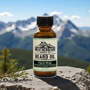 Bottle of Weatherbeard Supply Co. Palo Peak beard oil with a mountainous landscape in the background