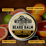 Weatherbeard Supply Co. Summit Sunrise beard balm container with features highlighted on a wooden background.