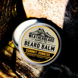 Tin of Weatherbeard Supply Co. Beard Balm Summit Sunrise on a wooden background
