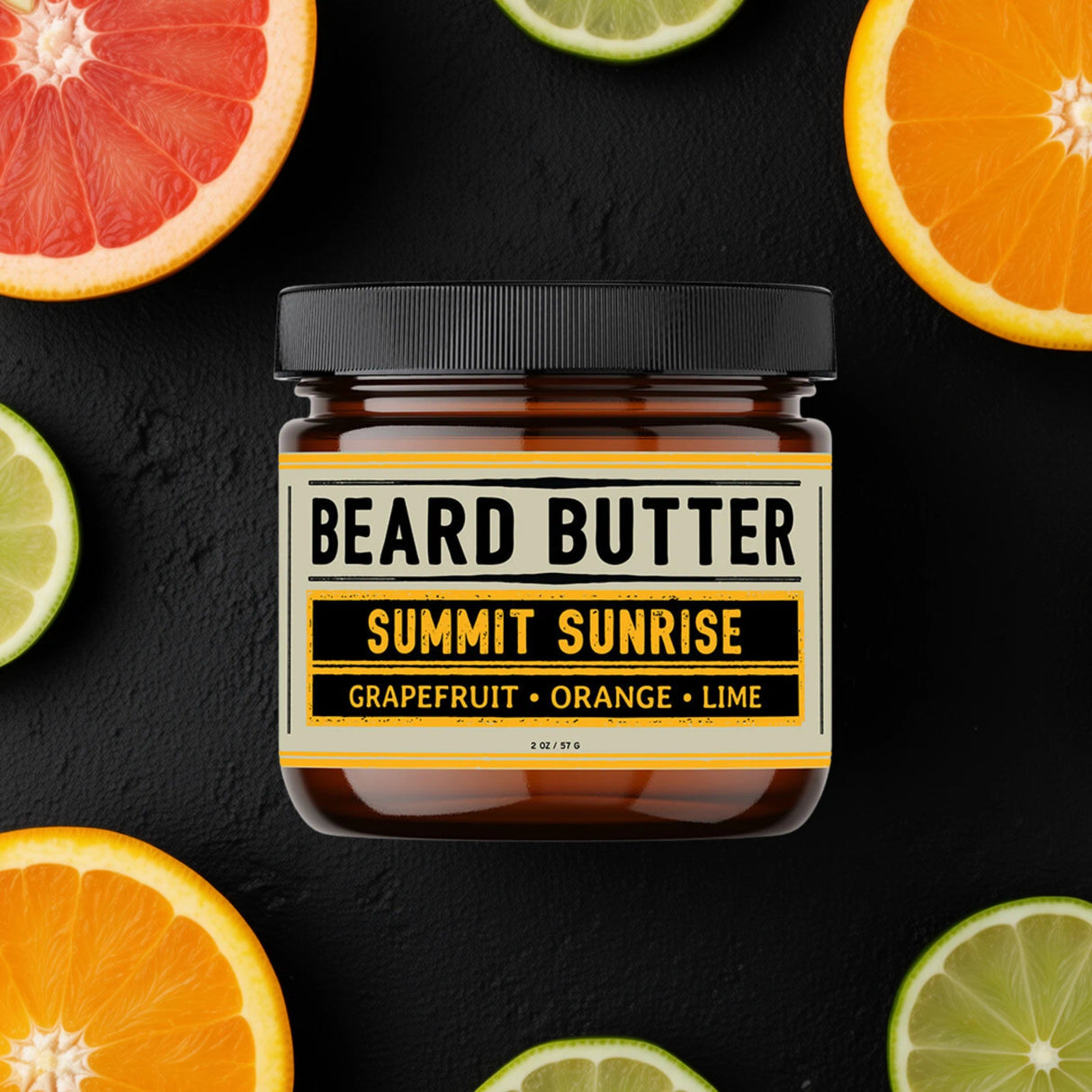 Jar of 'Summit Sunrise' beard butter surrounded by sliced citrus fruits on a black background