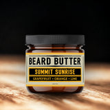 Jar of beard butter labeled 'Summit Sunrise' with a dark background