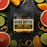 Jar of  'Summit Sunrise' Beard Butter surrounded by sliced citrus fruits on a dark surface