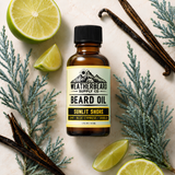 A bottle of Weatherbeard Supply Co's Sunlit Shore Beard Oil surrounded by lime, blue cypress, and vanilla