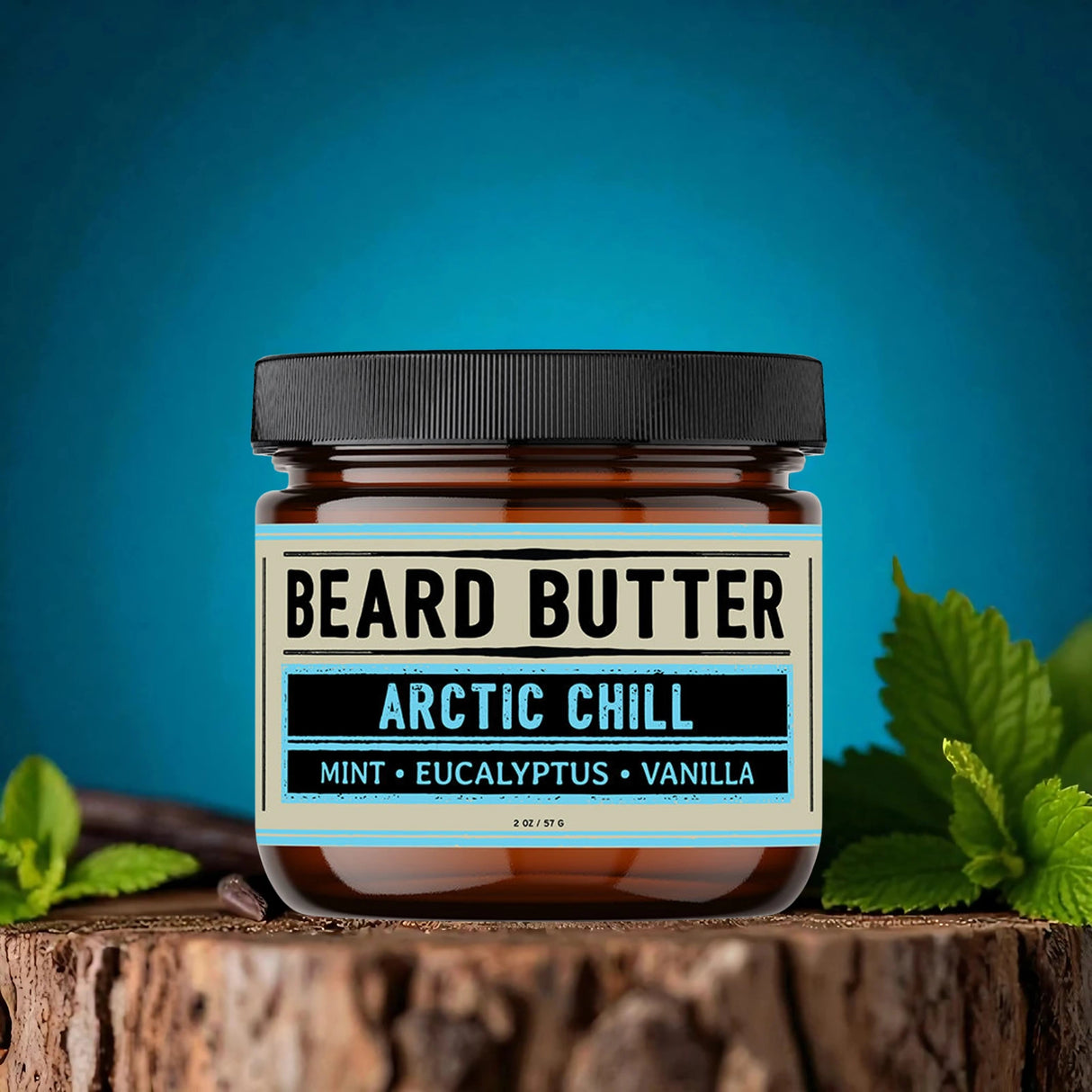 Jar of beard butter labeled 'Arctic Chill' with mint, eucalyptus, and vanilla on a wooden surface with a blue background.