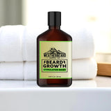 Bottle of Weatherbeard Supply Co. beard growth stimulator wash on a bathroom counter with towels in the background