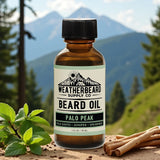 Bottle of Weatherbeard Supply Co. Palo Peak Beard Oil sitting in front of a mountain range 