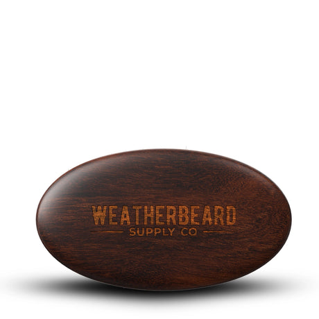 Wooden boars hair beard brush with 'Weatherbeard Supply Co' branding on a white background