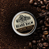 Beard balm container with 'Weatherbeard Supply Co' branding on a background of coffee beans.