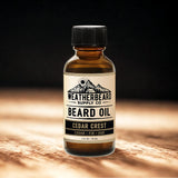 Bottle of Weatherbeard Supply Co. Cedar Crest Beard Oil on a wooden surface with a dark background