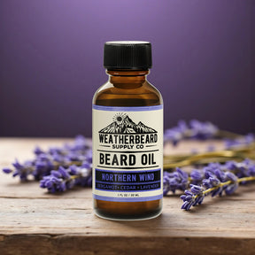 Bottle of Weatherbeard Supply Co. Beard Oil with lavender flowers on a wooden surface and purple background